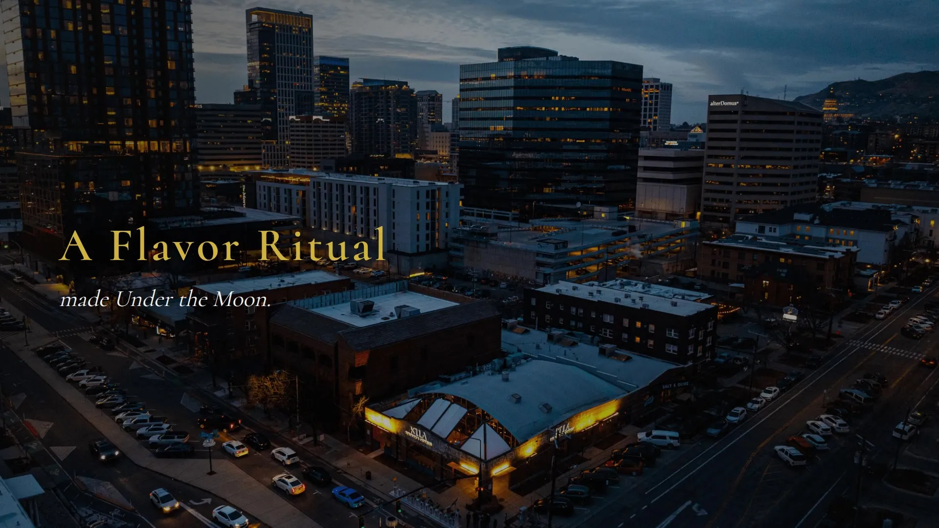 The Killa Nikkei restaurant website, with its food photography and gold-on-black identity